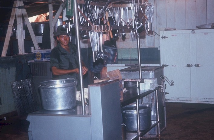 K Troop's kitchen was small but big hearted cooks like Russ Risden prepared delicious meals.
